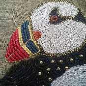 Puffin detail on olive silk