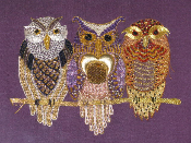 Three owls on purple silk